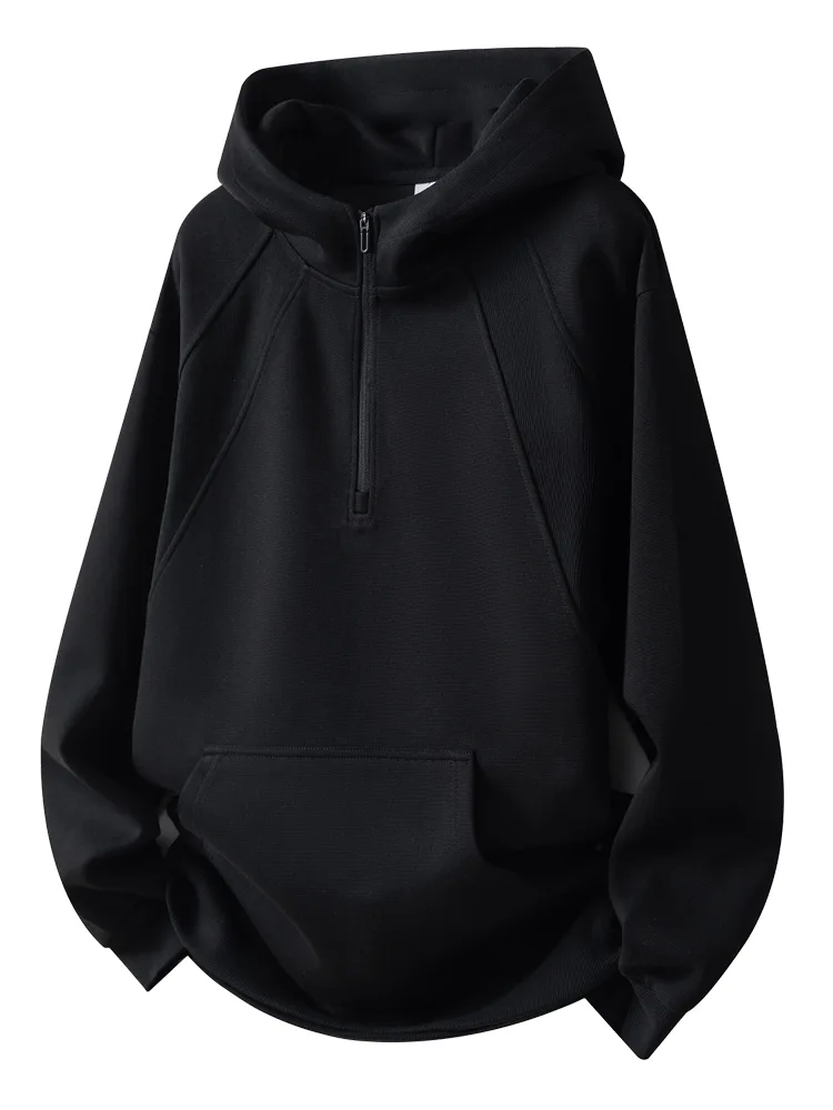 Black half-zip hooded sweatshirt laid flat, showing stitching, pocket and trims