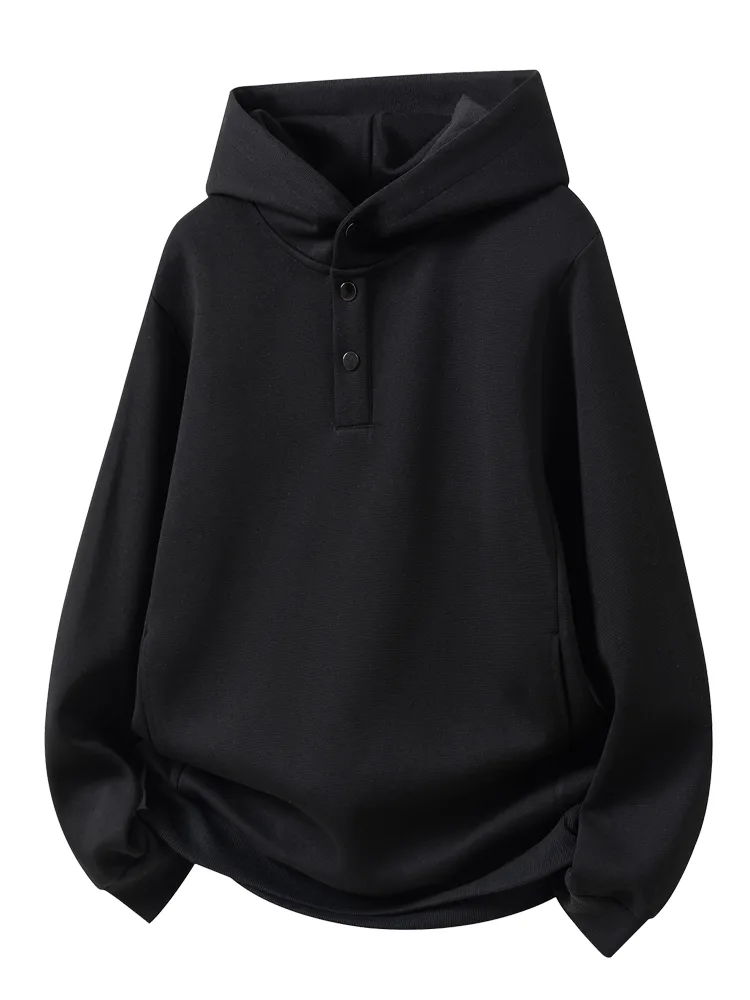 Black hooded sweatshirt with a buttoned front placket laid flat