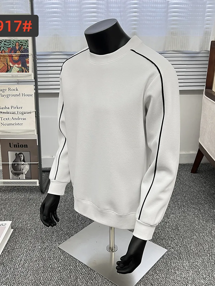 Off-white crewneck sweatshirt on a mannequin with ribbed cuffs and hem